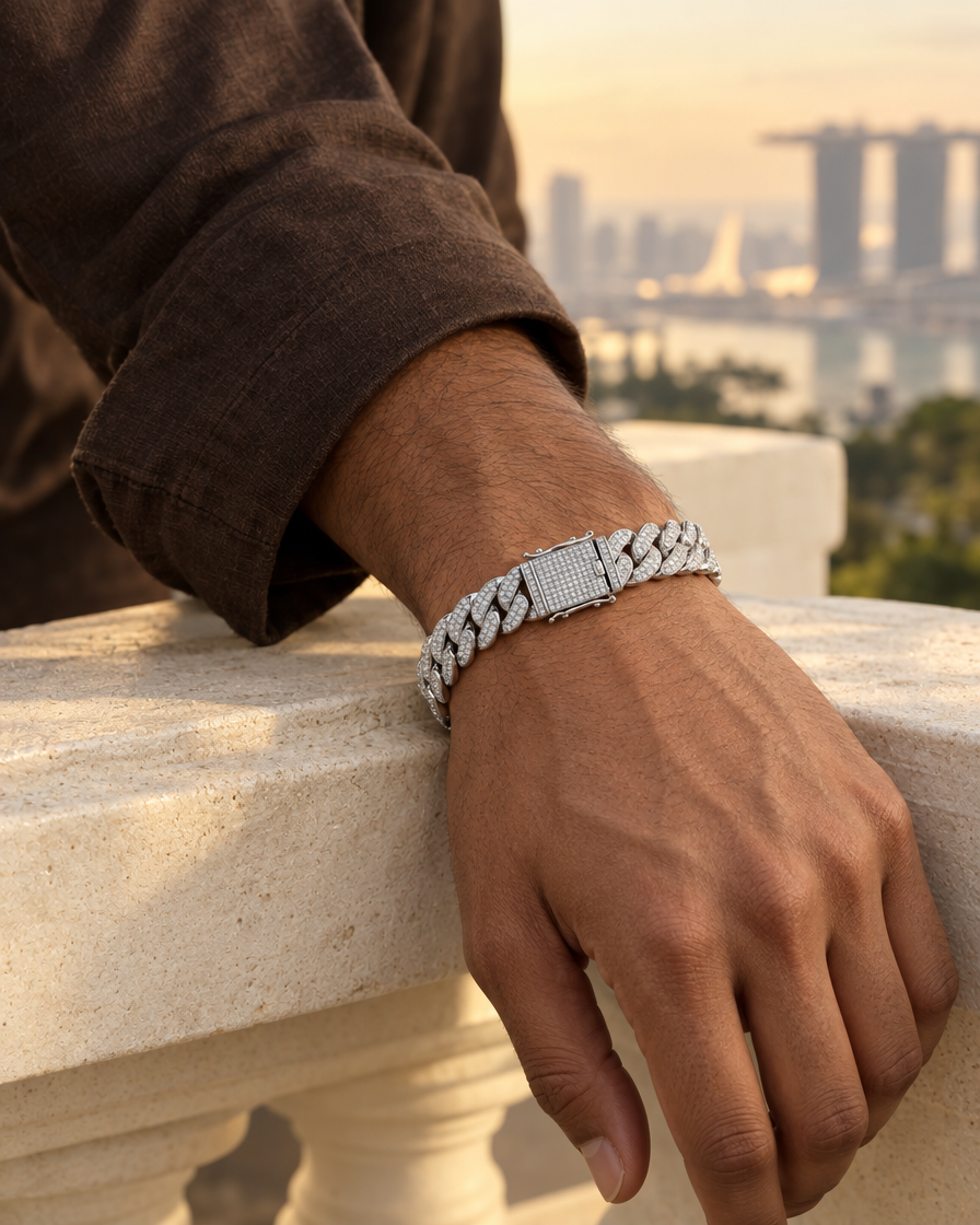 Model wearing the Frost Asia moissanite Cuban link bracelet in a white-metal finish