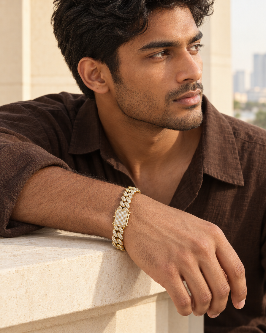 Model wearing the Frost Asia moissanite Cuban link bracelet in a yellow-metal finish