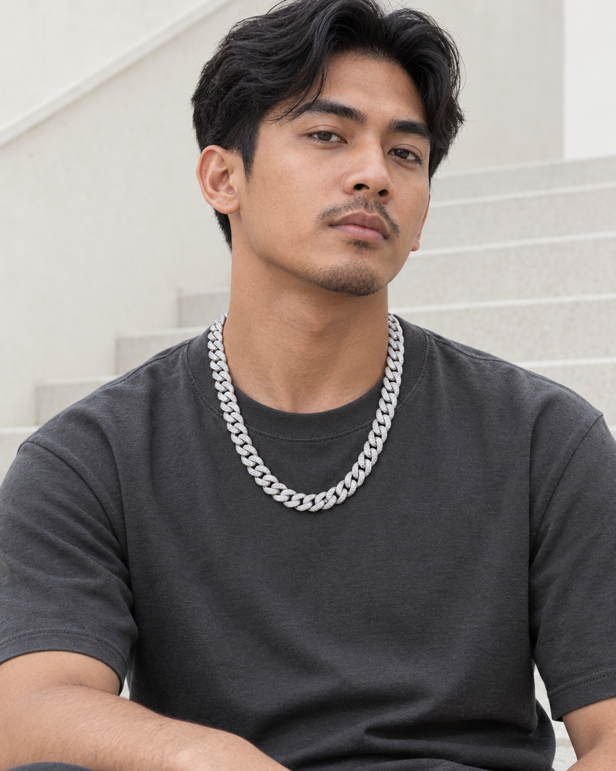 Model wearing the Frost Asia moissanite Cuban link chain in a white-metal finish