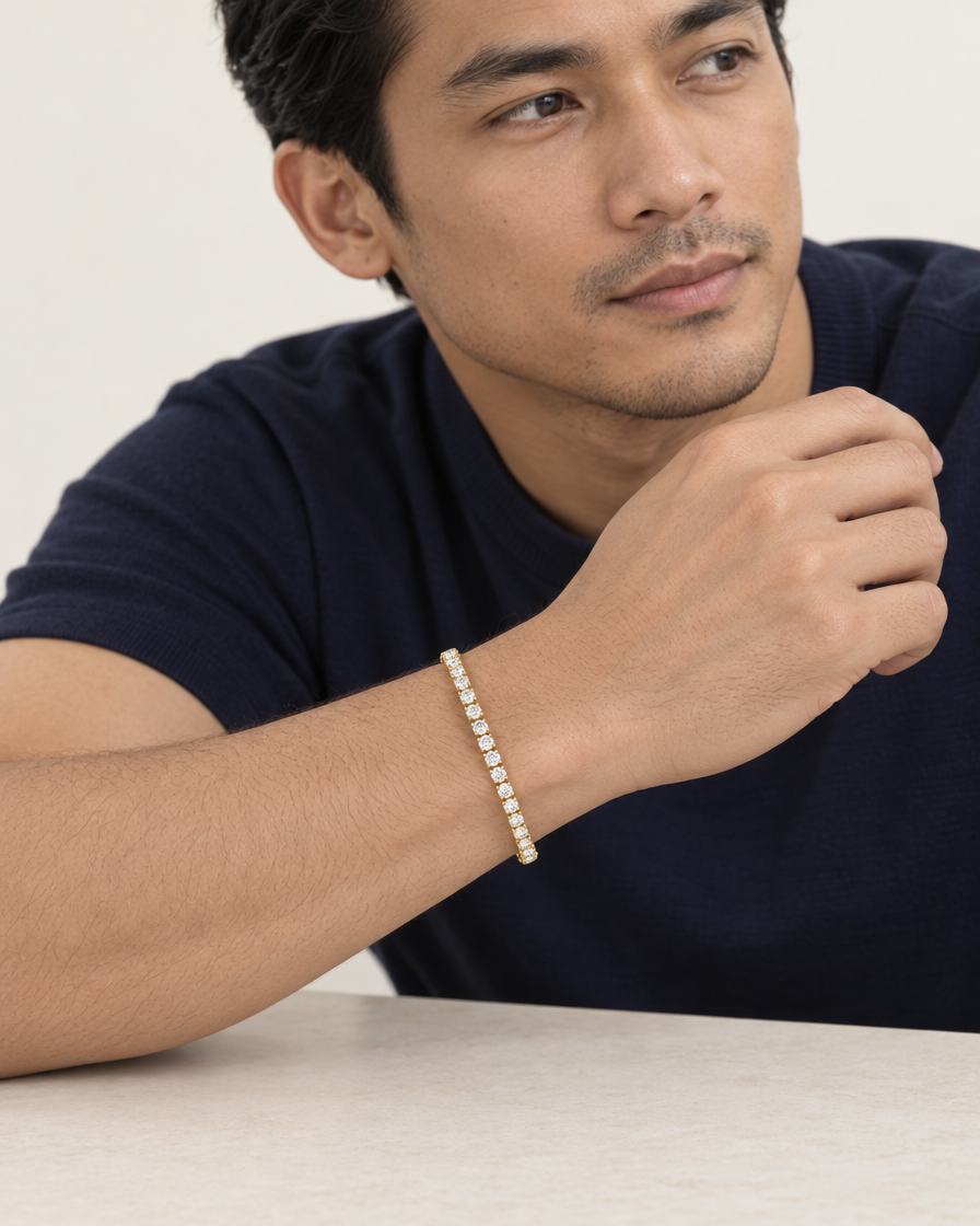 Model wearing the Frost Asia moissanite tennis bracelet in a yellow-metal finish