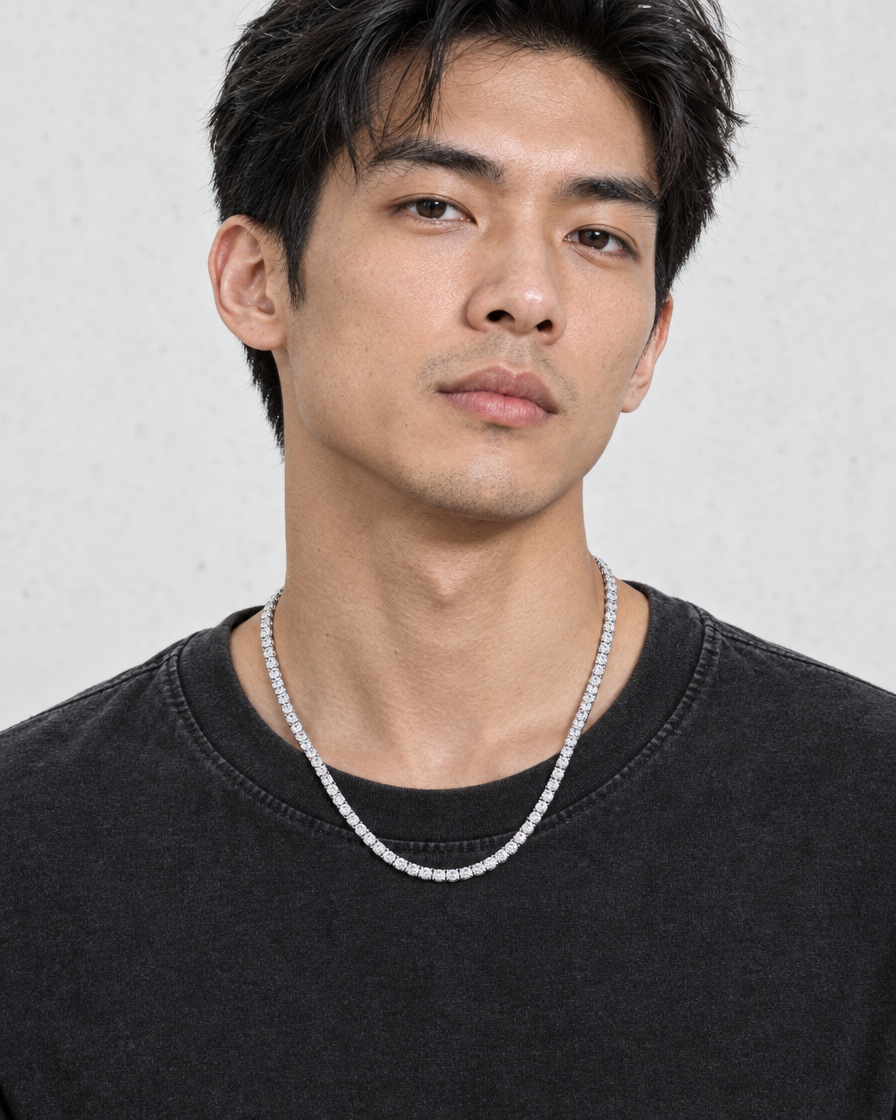 Model wearing the Frost Asia moissanite tennis chain in a white-metal finish