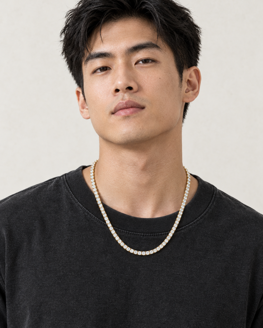 Model wearing the Frost Asia moissanite tennis chain in a yellow-metal finish